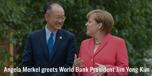 angela merkel greets world bank president jim yong kim angela merkel greets world bank president jim yong kim